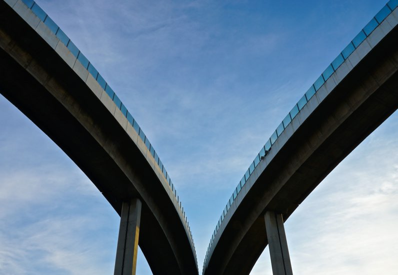 Two bridges curving in different directions