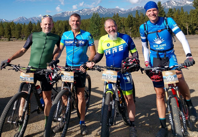 Four MRE Employees on mountain bikes